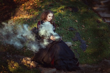 Woman makes a witch's potion, she's a witch.の写真素材