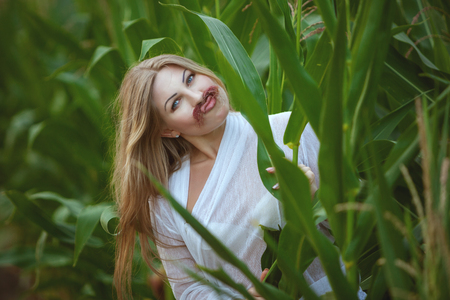 Woman jokingly attached herself a mustache, she was flirting.の写真素材