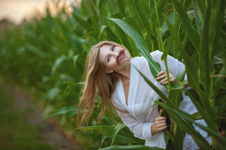 Woman has attached herself a mustache, she flirts playfully.の写真素材