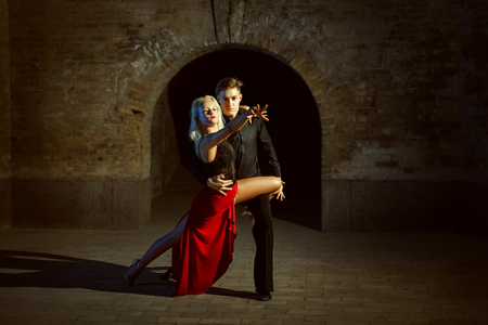 Portrait of a beautiful young couple. They dance tango.の写真素材
