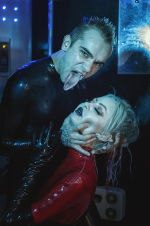Man holds a woman by force. He humiliates her while playing BDSM.の写真素材