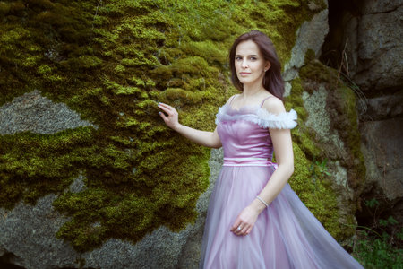 Woman in a magnificent purple dress, she looks like a princess.