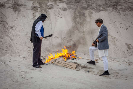 Afghan terrorists are destroying music. They burn musical supplies. They ban music in Afghanistan.の写真素材