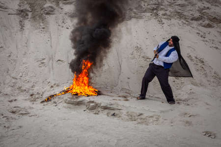 Afghan terrorists are destroying them with fire.  are intimidating people with weapons in their hands. Insurgent fighters are a terrorist guerrilla organization.の写真素材