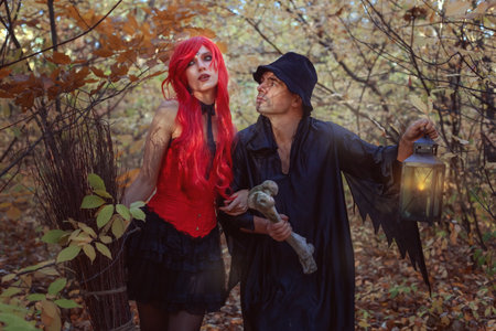 Fairy tale story, beautiful witch and dwarf in fairytale forest in autumn.の写真素材