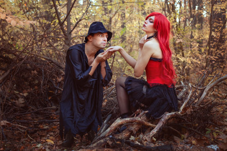 Fairy tale story, beautiful witch and dwarf in fairytale forest in autumn.の写真素材