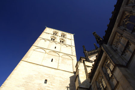 church in Munster, Germany from below with blue skyの写真素材