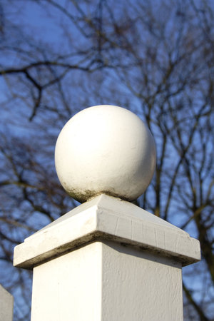 white ball on the fence