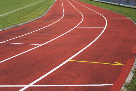 Red race track with white lines, athletics