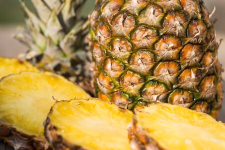 pineapple on a wooden boardの写真素材