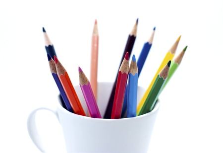 colored pencil in the cup on isolated white backgroundの写真素材