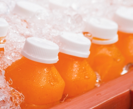 orange juice in the ice bucketの写真素材