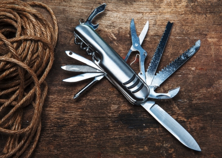multipurpose pocket knife on woodの写真素材