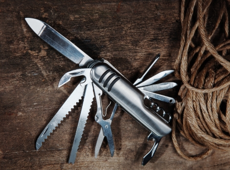 multipurpose pocket knife on woodの写真素材