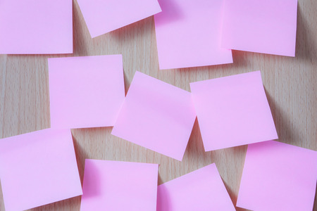 pink paper on wooden boardの写真素材