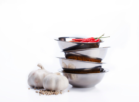 curry powder in bowl stack with chili ,garlic,pepper ingredientsの写真素材