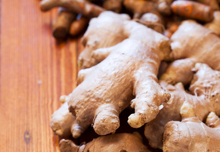 ginger and curcuma longa on wood close up