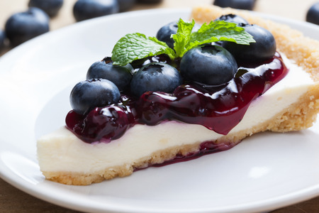 piece of blueberry cheesecake on plateの写真素材