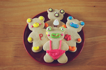cute animal cookies on red plate with effect color