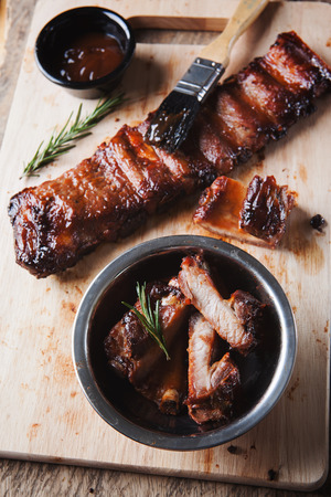 grilled pork rib with sauce on wooden boardの写真素材