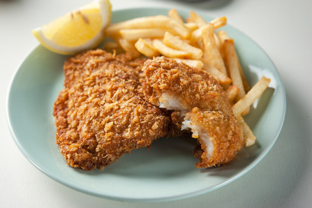 fish and chips in tint green plateの写真素材