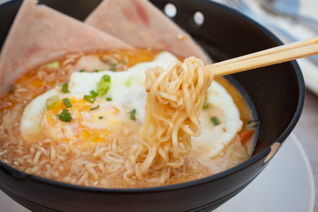 japanese noodle with fried egg and hamの写真素材