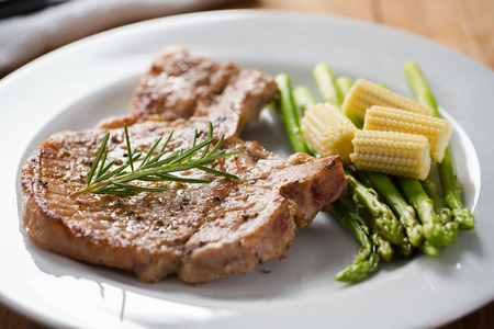 grilled pork chop with vegetable for mealの写真素材