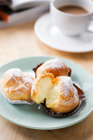 cream puff with vanilla stuff for coffee breakの写真素材