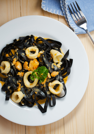 ink squid pasta with cuttlefish in plateの写真素材