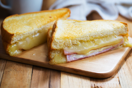 sandwich ham cheese on wooden boardの写真素材