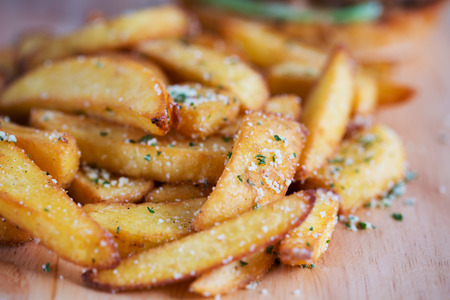 french fries on wooden boardの写真素材