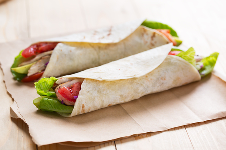 tortilla wrap with grilled chicken,avocado and vegetable for mealの写真素材