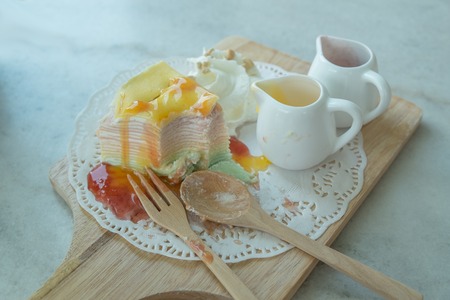 Rainbow Crepe Cake on the marble tableの写真素材