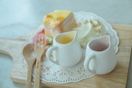 Rainbow Crepe Cake on the marble tableの写真素材