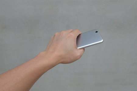 Hand with mobile phoneの写真素材