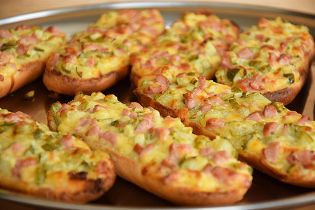 An open faced sandwich with bacon and cheeseの写真素材