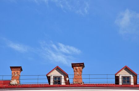 House roof and blue sky on fine weatherの写真素材