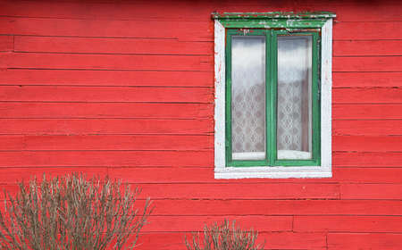 Colored window on a pink wooden wallの写真素材