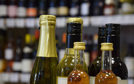 wine bottles of different sizes in wine store and ready for home delivery