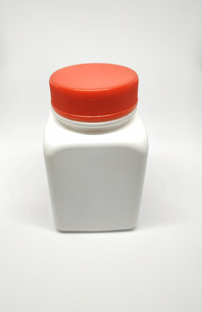 red cap white pill bottleの写真素材