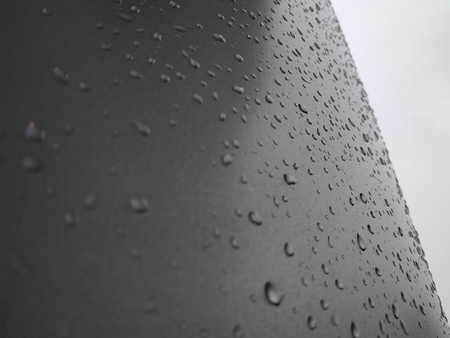rain on metal pole backgroundの写真素材