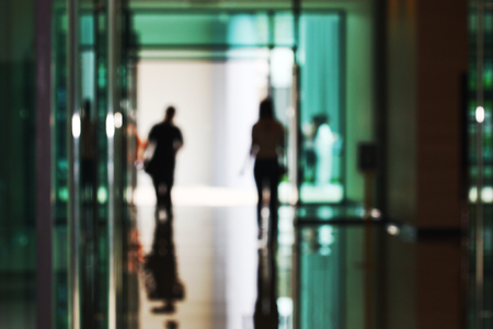 Blurry scene of people go out the doorの写真素材