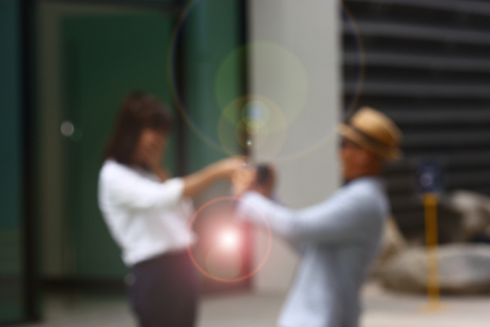 Blurry image of couple holding hand in loveの写真素材