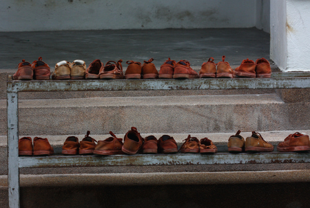 student shoes on the rackの写真素材