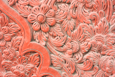 wall texture of brown clay flower layoutの写真素材