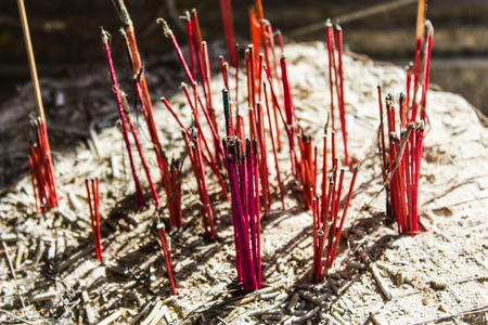 burnning incense and cinders in potの写真素材
