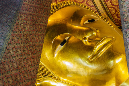 The giant Reclining Buddha in Wat Pho, Thailandの写真素材