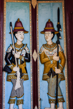 soldier art of old temple door in Bangkok Thailandのeditorial素材