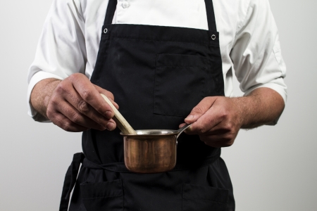chef holding copper panの写真素材