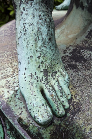 foot on old bronze statueの写真素材